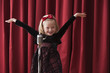 Caucasian girl singing into old-fashioned microphone