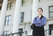 Caucasian businesswoman standing outdoors