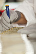 Photo: Woman working in electronics factory Woman working in electronics factory