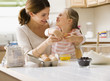 Caucasian mother and daughter baking together