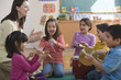 Students playing musical instruments in classroom