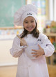 Caucasian girl dressed as chef