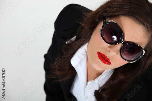 Photo: sexy woman wearing sunglasses sexy woman wearing sunglasses