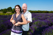 Happy middled aged couple in a field of purple lavender