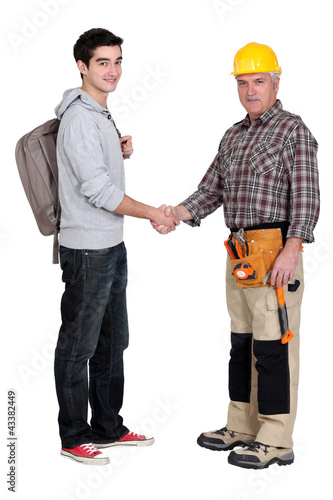 Photo: tradesman meeting his new apprentice for the first time tradesman meeting his new apprentice for the first time