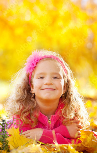 Photo: Happy girl in autumn park Happy girl in autumn park