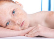 Portrait of an attractive freckled girl