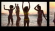 Friends standing on the beach