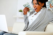 Photo: Surprised woman holding plenty of cash money Surprised woman holding plenty of cash money