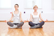 Photo: Women doing yoga exercise at gym Women doing yoga exercise at gym