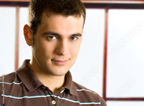 Photo: Portrait of happy smiling young man Portrait of happy smiling young man