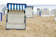 abandoned beach, white wicker beach chairs