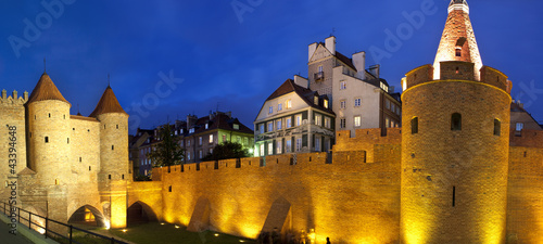 Photo: Night panorama view of castle in Warsaw old town. Poland Night panorama view of castle in Warsaw old town. Poland
