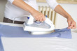Photo: bright picture of lovely housewife with iron bright picture of lovely housewife with iron