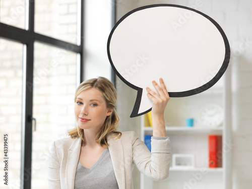 Photo: smiling businesswoman with blank text bubble smiling businesswoman with blank text bubble