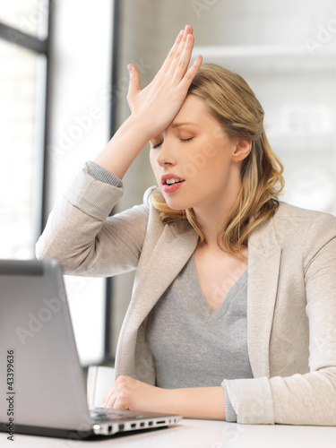 Photo: stressed woman with laptop computer stressed woman with laptop computer