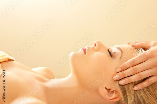 Photo: beautiful woman in massage salon beautiful woman in massage salon