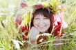 Young Woman Laying on Grass Portrait
