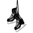 pair of black ice skates on white