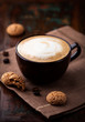 Cup of cafe au lait and biscotti on the table