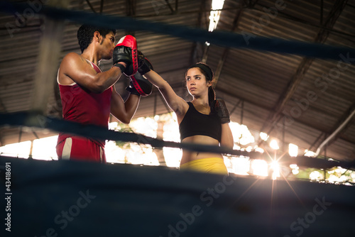 Photo: Young woman at boxing and self defense course Young woman at boxing and self defense course