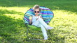 Video: Girl sitting on the chair outdoors Girl sitting on the chair outdoors