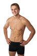 Photo: Cheerful young man in trunks over white background Cheerful young man in trunks over white background
