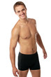Photo: Cheerful young man in trunks over white background Cheerful young man in trunks over white background