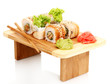 Tasty rolls served on wooden plate isolated on white