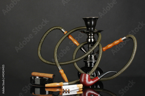 Photo: Smoking tools - a hookah, cigar, cigarette and pipe isolated Smoking tools - a hookah, cigar, cigarette and pipe isolated