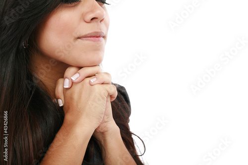 Photo: Closeup portrait of a young woman praying Closeup portrait of a young woman praying