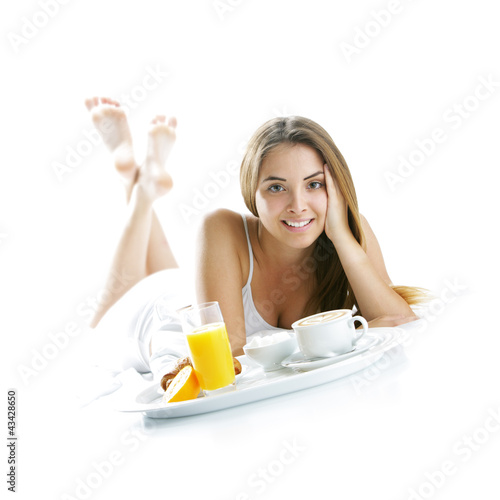 Photo: Smiling woman having breakfast Smiling woman having breakfast