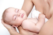 baby asleep on hands of mother