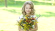 Video: Preschooler girl with flowers outdoors Preschooler girl with flowers outdoors