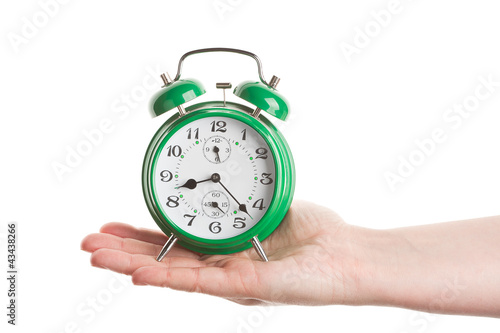Photo: Hand holding alarm clock Hand holding alarm clock