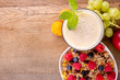 Foto: Healthy breakfast on wooden table, focused on drink. Healthy breakfast on wooden table, focused on drink.