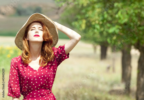 Photo: Redhead girl at outdoor. Redhead girl at outdoor.
