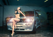 Photo: Model at the car wash in garage. Cross processing Model at the car wash in garage. Cross processing