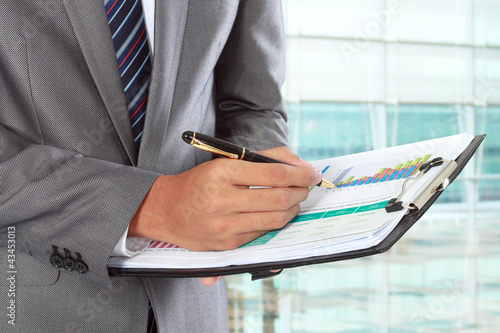 Foto: businessman writing businessman writing