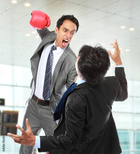 Photo: businessmen fighting businessmen fighting
