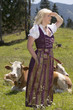 Photo: Junge Frau im Dirndl auf der Alm Junge Frau im Dirndl auf der Alm