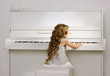 little girl playing the piano