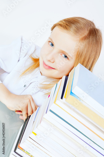 Photo: small smiling girl with books small smiling girl with books