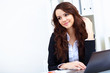 Foto: Young busines woman with notebook Young busines woman with notebook