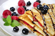 Pancakes sereved with raspberries