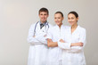 Three young doctor in white uniform