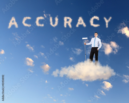 Photo: Businessman against blue sky Businessman against blue sky