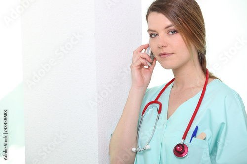Photo: Nurse on phone Nurse on phone