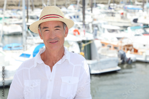 Photo: Senior man in front of port Senior man in front of port