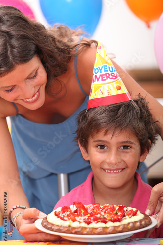 Photo: Young boy celebrating his birthday Young boy celebrating his birthday